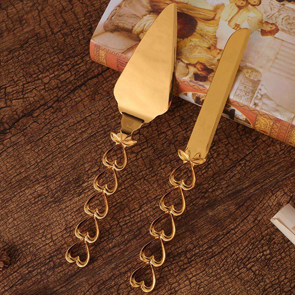 ALDO Party & Celebration > Party Supplies > Party Favors > Wedding Favors New / Stainless steel / Cake Knife cutter: 25.5cm x 2cm/10.04" x 0.79" inch 26cm x 5.7cm/10.24" x 2.24" Beutiful Laxury Bride and Groom French Court Golden Heart Hendle Cake Knife and Cake Shovel Set